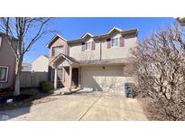 Charming two-story home featuring a combination of vinyl siding and brick with a two car garage and inviting front porch at 2656 Frasier Fir Dr, Greenwood, IN 46143