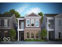 Two-story brown brick home with balcony and white trim at 549 Gilder Dr, Carmel, IN 46032