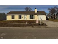Ranch style home with attached garage, landscaped yard, and neutral siding at 984 E Williamsburg Ln, Nineveh, IN 46164
