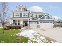 Charming two-story home featuring a three-car garage and impeccable curb appeal at 10214 Cloverbank Dr, Fishers, IN 46040