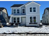 New two-story home featuring a modern farmhouse exterior with board and batten, and white trim windows at 14378 Bishop Birch Pl, Carmel, IN 46032
