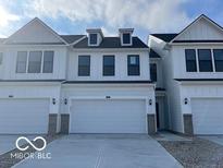 Two-story white house with gray roof, attached garage, and landscaping at 3296 Morab Dr, Zionsville, IN 46077