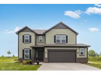 Two-story home with an attached garage, green siding, black shutters and a well-manicured lawn at 349 N Post Oak Dr, Mooresville, IN 46158