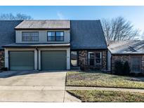 Charming townhouse featuring a two-car garage and well-maintained landscaping at 788 Monte Vista Ct, Greenwood, IN 46143