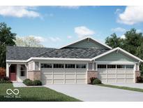 Three-unit townhome building with brick and siding exterior, two-car garages, and landscaping at 10349 Gateway Dr, Brownsburg, IN 46234