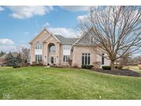Stunning brick home with a sprawling front lawn and beautiful landscaping at 11106 Muirfield Trce, Fishers, IN 46037