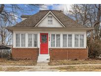 Brick house with a red door and sun porch at 202 W Wiley St, Greenwood, IN 46142