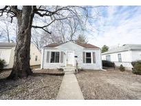 Charming single-story home featuring a well-maintained yard and classic architectural details at 4034 N Temple Ave, Indianapolis, IN 46205