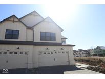 New construction townhome with a two-car garage and modern farmhouse architectural details at 4171 Douro Trl, Westfield, IN 46062