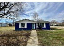 Charming blue house with white trim and a landscaped yard at 510 S St Clair St, Martinsville, IN 46151