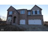 New construction home with a brick exterior and a two-car garage at 1144 Ridgevine Rd, Greenwood, IN 46143