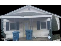 White house with covered porch, blue shutters, and small front yard at 1909 And 1901 S Pershing Ave, Indianapolis, IN 46221