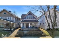Charming two-story home with a covered front porch and inviting curb appeal at 625 Sanders St, Indianapolis, IN 46203