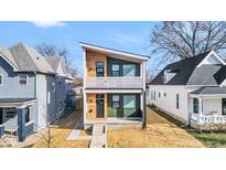 Modern two-story home with wood and green siding at 1415 Union St, Indianapolis, IN 46225