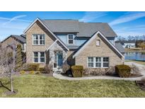 Charming two-story home with brick and stone accents, a manicured lawn, and a welcoming front entrance at 377 Morningside Dr, Brownsburg, IN 46112