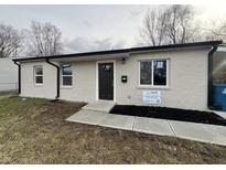 Newly renovated ranch home with neutral brick exterior and modern landscaping at 9513 E 39Th Pl, Indianapolis, IN 46235