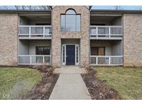Inviting condo building with brick facade, balconies, and a well-manicured lawn at 1737 E 56Th St # B, Indianapolis, IN 46220