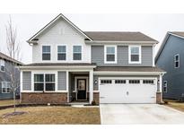 Charming two-story home with gray siding, white trim, and a well-maintained front lawn at 2242 Egbert Rd, Westfield, IN 46074