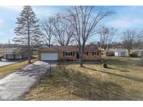 Ranch house with a long driveway and a large backyard at 3052 S Fielding Rd, New Palestine, IN 46163