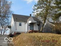 White house with a gabled roof and small front yard at 3531 Brown St, Anderson, IN 46013