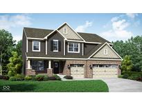 Two-story home showcasing brick and dark siding, complemented by a well-manicured lawn and a two-car garage at 563 Mccaffrey Cir, Westfield, IN 46074