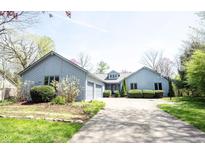 Charming single Gathering home with an attached two-car garage and a well-manicured front yard at 8041 Halyard Way, Indianapolis, IN 46236