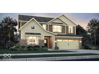 Two-story home featuring mixed brick and board siding and a two-car garage, set amidst green landscaping at 8952 Alexander Ridge Dr, McCordsville, IN 46055