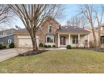 Brick two-story house with attached garage and manicured lawn at 1016 Saratoga Cir, Indianapolis, IN 46280