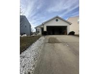 Ranch home with attached garage and landscaping at 1810 Farm Meadow Dr, Greenwood, IN 46143