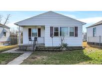 Charming white house with a small front porch and well-maintained lawn at 1837 E Legrande Ave, Indianapolis, IN 46203