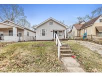 Charming bungalow with steps leading to the front entrance at 2875 Adams St, Indianapolis, IN 46218