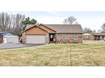 Brick ranch home with attached garage and spacious lawn at 2978 N 100 W, Greenfield, IN 46140