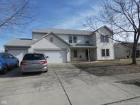 Two-story house with attached garage and landscaping at 741 Crystal Farms Dr, Avon, IN 46123
