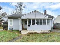Gray house with porch and small yard at 3541 N Linwood Ave, Indianapolis, IN 46218