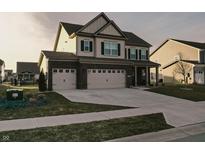 Two-story home with three-car garage and landscaped yard at 3884 Justify Dr, Bargersville, IN 46106