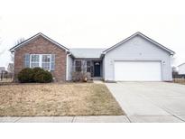 Charming single-Gathering home with brick and siding exterior and a well-manicured front yard at 5782 Jamestown Square Ln, Indianapolis, IN 46234