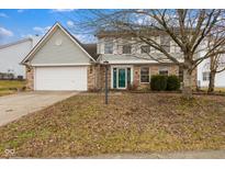 Charming two-story home featuring a well-maintained yard and attached two-car garage at 8351 Sawgrass Dr, Indianapolis, IN 46234
