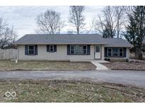 Charming single-story home with neutral siding and contrasting shutters at 8505 W Jackson St, Muncie, IN 47304