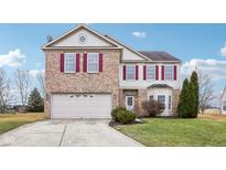 Charming two-story home with brick accents, red shutters, and attached two-car garage at 12735 White Rabbit Dr, Indianapolis, IN 46235