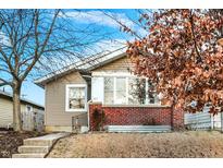 Charming single-story home with brick accents, a cozy front porch, and a well-maintained lawn at 3933 Byram Ave, Indianapolis, IN 46208