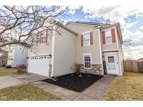 Charming two-story home with red shutters and a well-manicured lawn, providing excellent curb appeal at 9703 W Stargazer Dr, Pendleton, IN 46064