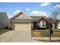 Charming single-story brick home with a two-car garage and well-maintained lawn at 13998 Avalon Blvd, Fishers, IN 46037