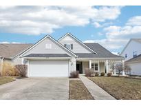 Charming single-story home with a well-manicured lawn and attached two-car garage at 15104 Smithfield Dr, Westfield, IN 46074