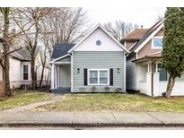 Charming single-Gathering home with a well-maintained lawn and inviting curb appeal at 1133 Olive St, Indianapolis, IN 46203