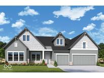 Charming two-story home featuring a symmetrical facade, gray siding, and a two-car garage at 19826 Chatham Shore Ln, Westfield, IN 46074