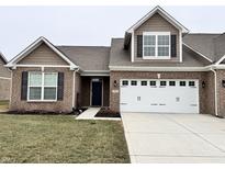 Charming single-Gathering home boasting a brick facade, complemented by a two-car garage and well-maintained lawn at 253 Darrough Dr, Greenwood, IN 46143