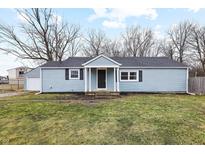 Charming blue home with a well-maintained lawn and neutral colored accents at 2625 Raible Ave, Anderson, IN 46011