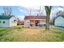 Charming single-story home with a cozy front porch and well-maintained lawn at 3051 N Tacoma Ave, Indianapolis, IN 46218