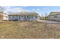Charming single-story home with a covered porch and inviting curb appeal at 453 Carol Dr, Greenwood, IN 46143