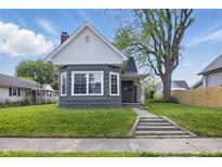 Charming home with a well-maintained front yard, mature tree, and welcoming entrance at 806 S 17Th St, Elwood, IN 46036